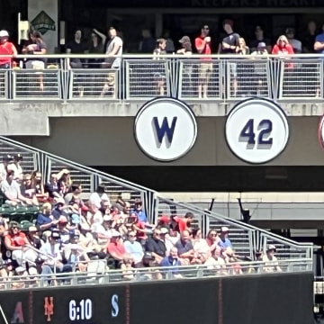 The Twins retired the Washington Senators' "W" during a pregame ceremony honoring the Senators' 1924 World Series championship ahead of their series finale against the Cleveland Guardians on Sunday, Aug. 11, 2024, at Target Field in Minneapolis.