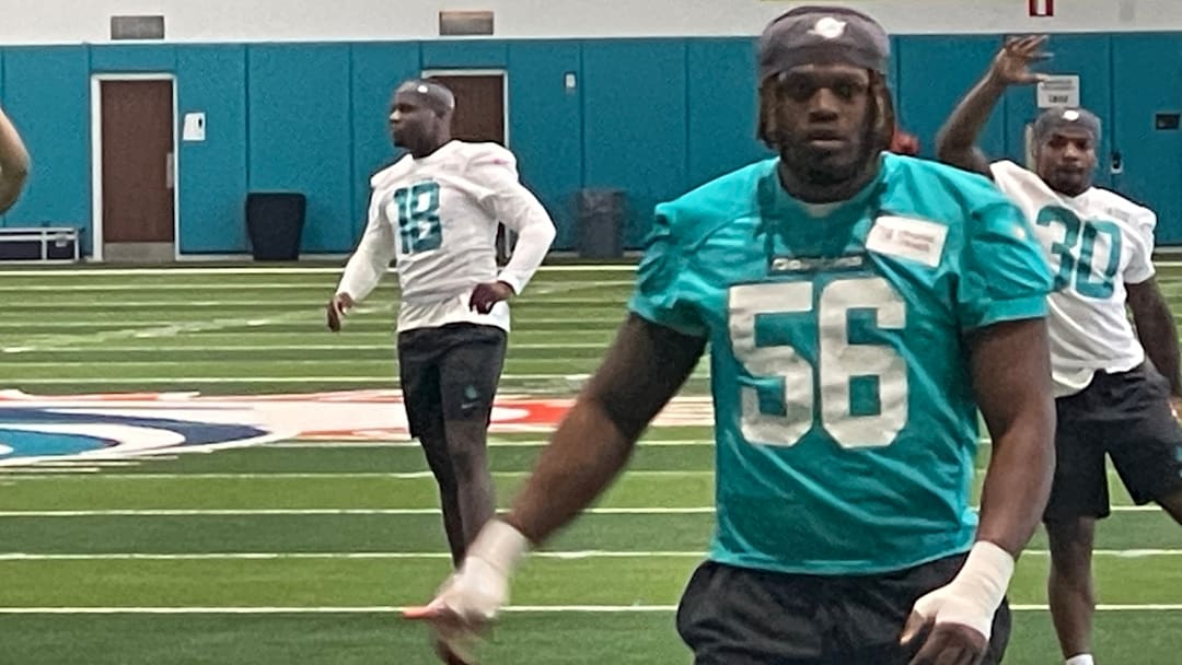 Miami Dolphins players stretch on the first day of the 2026 rookie minicamp