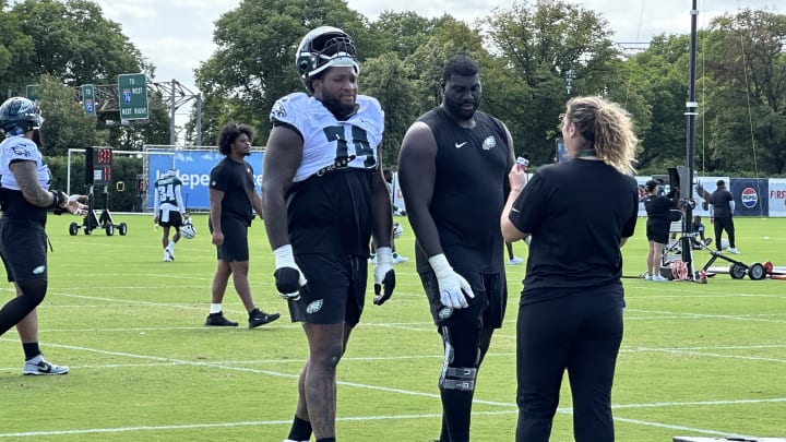 Eagles backup tackle Fred Johnson (left) with Mekhi Becton on Day 15 of training camp.