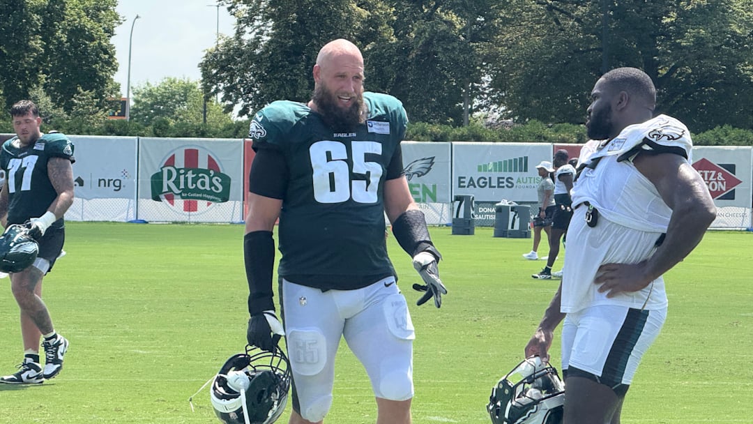Lane Johnson and Moro Ojomo discuss a drill during Eagles training camp.