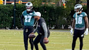 Jaire Alexander (right) works with Quinyon Mitchell (left) and DB coach Christian Parker during Friday's practice as the Eagles prepare to travel to Green Bay for Monday Night Football.