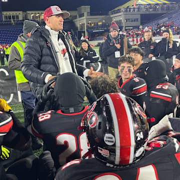 Quince Orchard head football coach John Kelley addresses his team after its victory in the 2024 MPSSAA 4A state championship game.