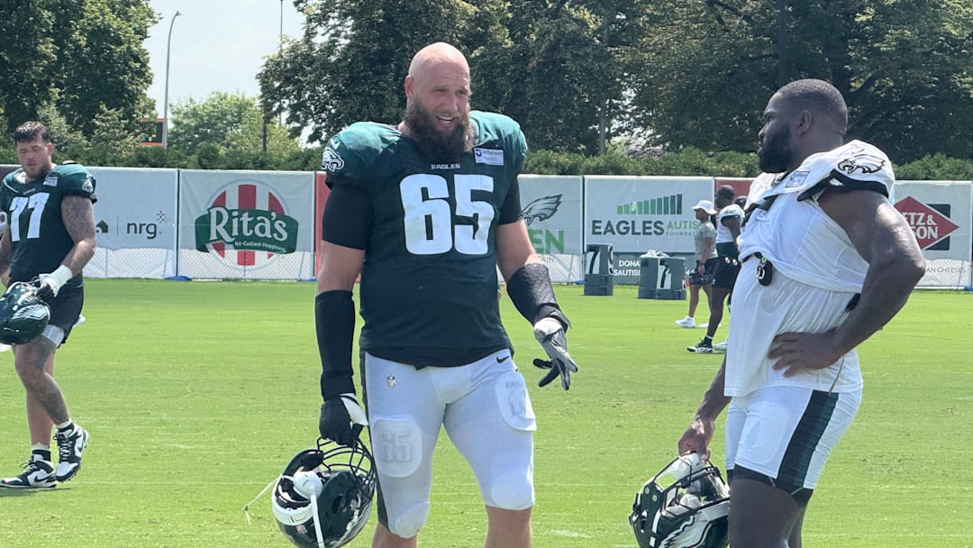 Lane Johnson and Moro Ojomo discuss a drill during Eagles training camp.