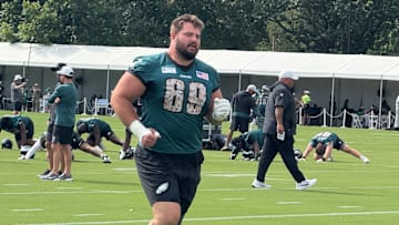 Landon Dickerson was carted off the field late in Sunday night's open practice at Lincoln Financial Field with appeared to be a knee injury.