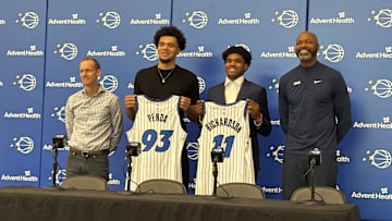 June 27, 2025: Jase Richardson and Noah Penda pose with Orlando Magic president of basketball operations Jeff Weltman and head coach Jamahl Mosley at an introductory Press Conference. 