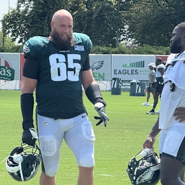 Lane Johnson and Moro Ojomo discuss a drill during Eagles training camp.
