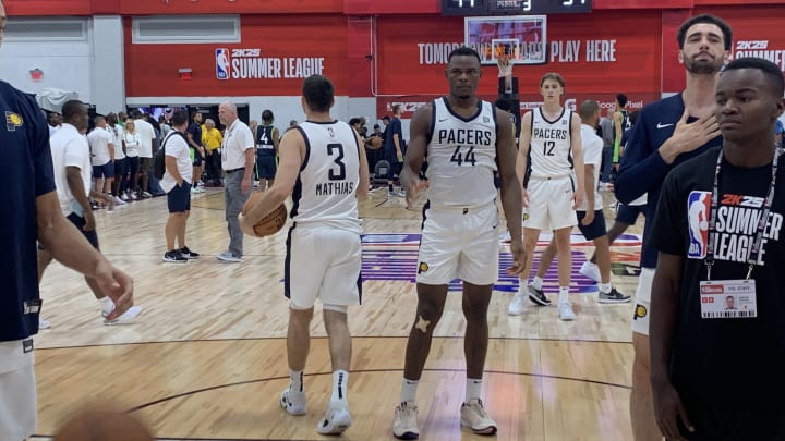 Indiana Pacers wing Dakota Mathias and center Oscar Tshiebwe warm up before the second half of a summer league game against the Minnesota Timberwolves. (Mandatory Photo Credit: Tony East)