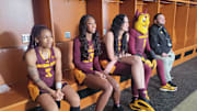 Arizona State women's basketball players Tyi Skinner (from left), Jalyn Brown and Kennedy Basham sit with ASU mascot Sparky at Big 12 Media Day in October 2024.
