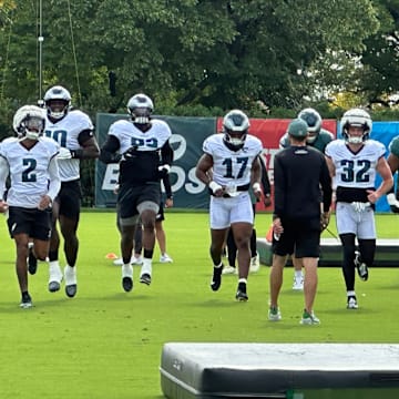 Eagles defense goes through some pre-practice warmups during training camp.