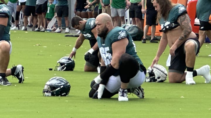 Eagles right tackle Lane Johnson stretches before a training camp practice.