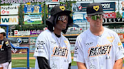 Eagles teammates DeVonta Smith and Cooper DeJean get ready for the home run contest at Smith's 5th annual Celebrity All-Star Game on June 28. 2025 in Allentown.