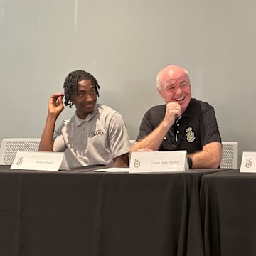 Longtime Bishop Montgomery basketball coach Doug Mitchell (center) reached the 800-win career mark to make him 15th all-time in California.