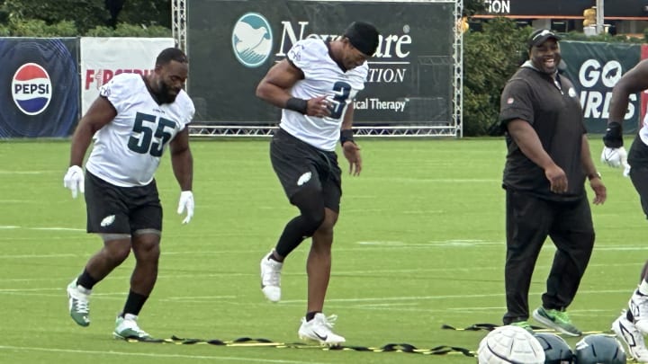 Brandon Graham (left) and Nolan Smith go through a ladder drill prior to one of the Eagkes' training camp practices.