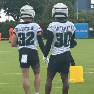 Quinyon Mitchell (right) with safety Reed Blankenship