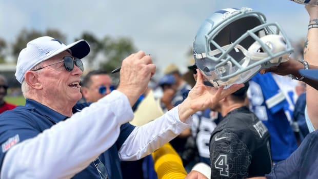Cowboys owner Jerry Jones signs autographs during training camp at River Ridge Fields in Oxnard on Saturday, July 29, 2023.