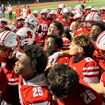 Archbishop Spalding football players sing its The Cavaliers moved to 4-0 with a 45-0 win over McDonogh School Friday evening.