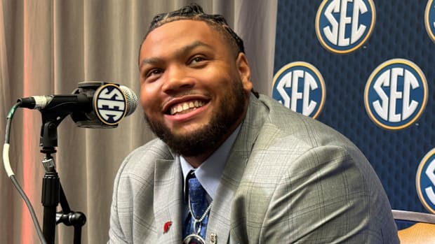 Arkansas Razorbacks defensive tackle Cam Ball speaks in the main media room of SEC Media Days 