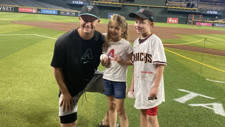 Paul Sewald with two kids representing Child Crisis at Chase Field 