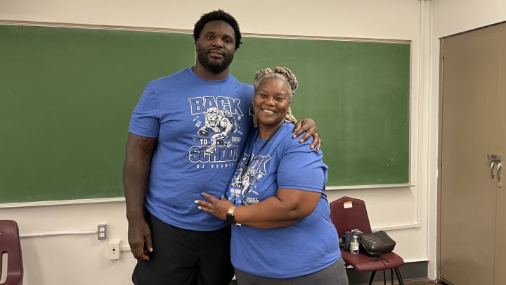 DJ Reader poses for a photo with his mother Felicia.