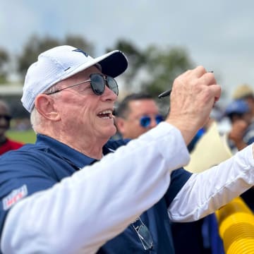 Cowboys owner Jerry Jones signs autographs during training camp at River Ridge Fields in Oxnard on Saturday, July 29, 2023.