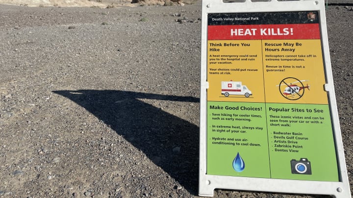 A sign warning about heat at the Badlands Loop Trailhead