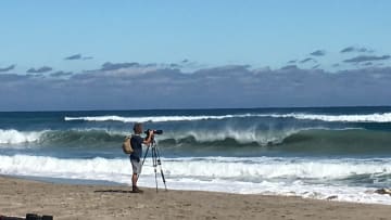 A photographer takes pictures of surfers on Midtown beach in Palm Beach on Nov. 7, 2021.

Img 2502