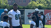 Jalen Carter talks with teammate Nakobe Dean before Day 2 of Eagles training camp.