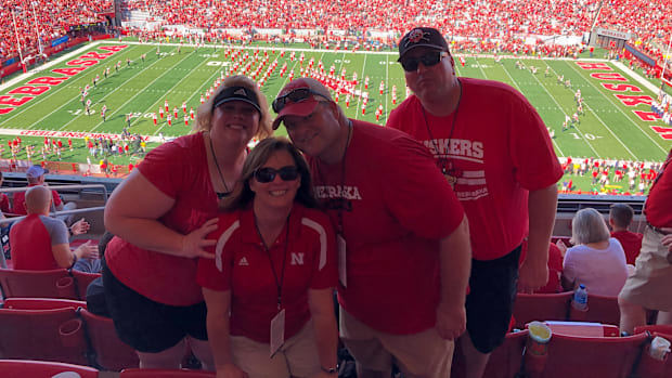 Amy and Scott Cyboron with relatives at Memorial Stadium.