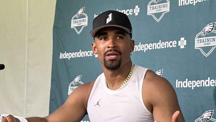 Quarterback Jalen Hurts talks with reporters following the first practice of training camp on July 24, 2024.