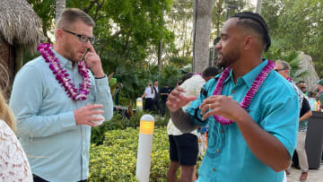 Dolphins quarterback Tua Tagovailoa talks football with a guest at the third annual Luau with Tua on