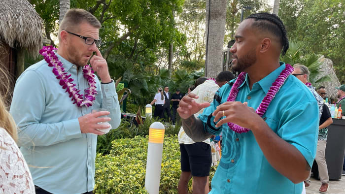 Dolphins quarterback Tua Tagovailoa talks football with a guest at the third annual Luau with Tua on