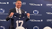 Penn State Nittany Lions football coach Matt Campbell poses with a jersey during his introductory press conference in State College. 