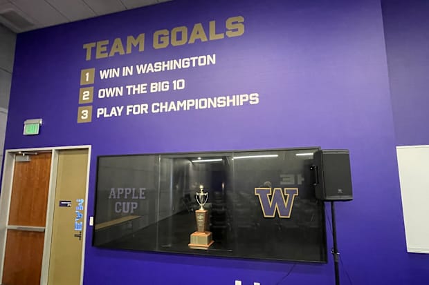 The Apple Cup trophy is prominently displayed in the Husky team room.