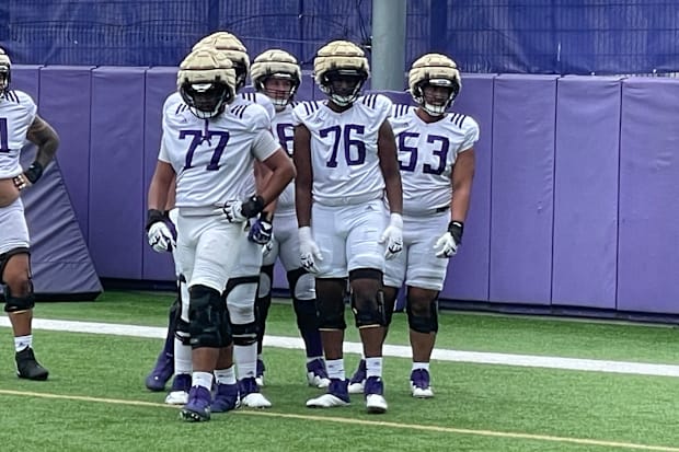 Max McCree (77) was next in line during this fall camp drill. 