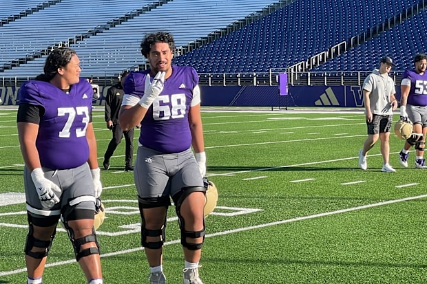 Champ Taulealea and Soane Faasolo leave the field together. 