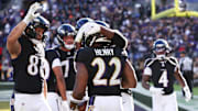 Oct 26, 2025; Baltimore, Maryland, USA; Baltimore Ravens running back Derrick Henry (22) celebrates with teammates after scoring a touchdown against the Chicago Bears in the fourth quarter at M&T Bank Stadium. Mandatory Credit: Geoff Burke-Imagn Images
