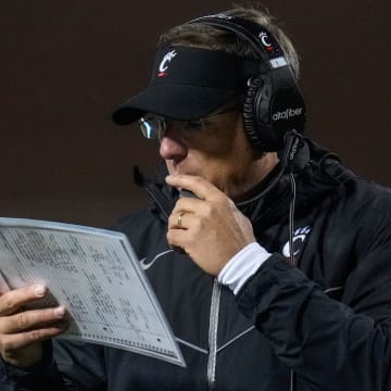 Cincinnati Bearcats head coach Scott Satterfield attempts to call a play following a touchdown in the fourth quarter of the NCAA Big12 football game between the Oklahoma State Cowboys and the Cincinnati Bearcats at Boone Pickens Stadium in Stillwater, Okla., on Saturday, Oct. 28, 2023.