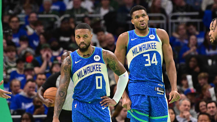 Milwaukee Bucks guard Damian Lillard (0) and forward Giannis Antetokounmpo (34) looks on during a timeout in the fourth quarter against the New York Knicks at Fiserv Forum. 