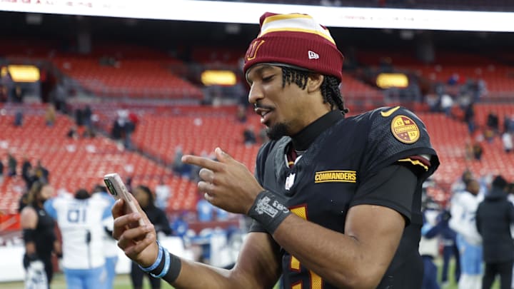 Washington Commanders quarterback Jayden Daniels records a social media video.