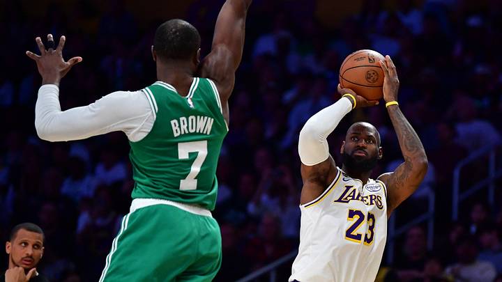 Feb 22, 2026; Los Angeles, California, USA; Los Angeles Lakers forward LeBron James (23) shoots against Boston Celtics guard Jaylen Brown (7) during the second half at Crypto.com Arena. Mandatory Credit: Gary A. Vasquez-Imagn Images