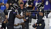 Sep 22, 2025; Baltimore, Maryland, USA; Baltimore Ravens running back Derrick Henry (22) and quarterback Lamar Jackson (8) react after a touchdown against the Detroit Lions during the first half at M&T Bank Stadium. Mandatory Credit: Peter Casey-Imagn Images