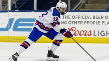 Feb 7, 2024; Plymouth, MI, USA; USA s Cole Hutson (23) skates up ice with the puck against Finland during the third period of the 2024 U18 s Five Nations Tournament at USA Hockey Arena. Mandatory Credit: David Reginek-USA TODAY Sports