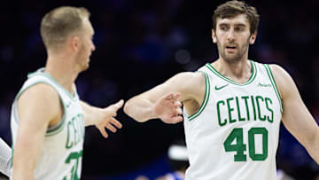 Boston Celtics center Luke Kornet (40) high-fives forward Sam Hauser (30) after scoring against the Philadelphia 76ers during the third quarter at Wells Fargo Center.