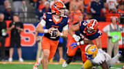 Oct 18, 2025; Syracuse, New York, USA; Syracuse Orange quarterback Luke Carney (11) looks to pass against the Pittsburgh Panthers during the second half at the JMA Wireless Dome. Mandatory Credit: Rich Barnes-Imagn Images