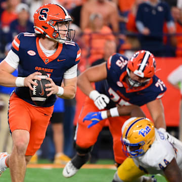 Oct 18, 2025; Syracuse, New York, USA; Syracuse Orange quarterback Luke Carney (11) looks to pass against the Pittsburgh Panthers during the second half at the JMA Wireless Dome. Mandatory Credit: Rich Barnes-Imagn Images