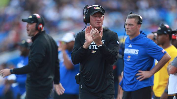 Kansas Jayhawks head coach Lance Leipold applauds on the sidelines during the first half of the game against West Virginia Mountaineers at David Booth Kansas Memorial Stadium on Sept. 20, 2025.