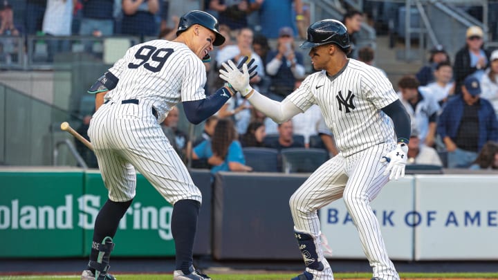 New York Yankees right fielder Juan Soto (22) celebrates with center fielder Aaron Judge (99) after hitting a solo home run during the first inning against the Cleveland Guardians at Yankee Stadium. 