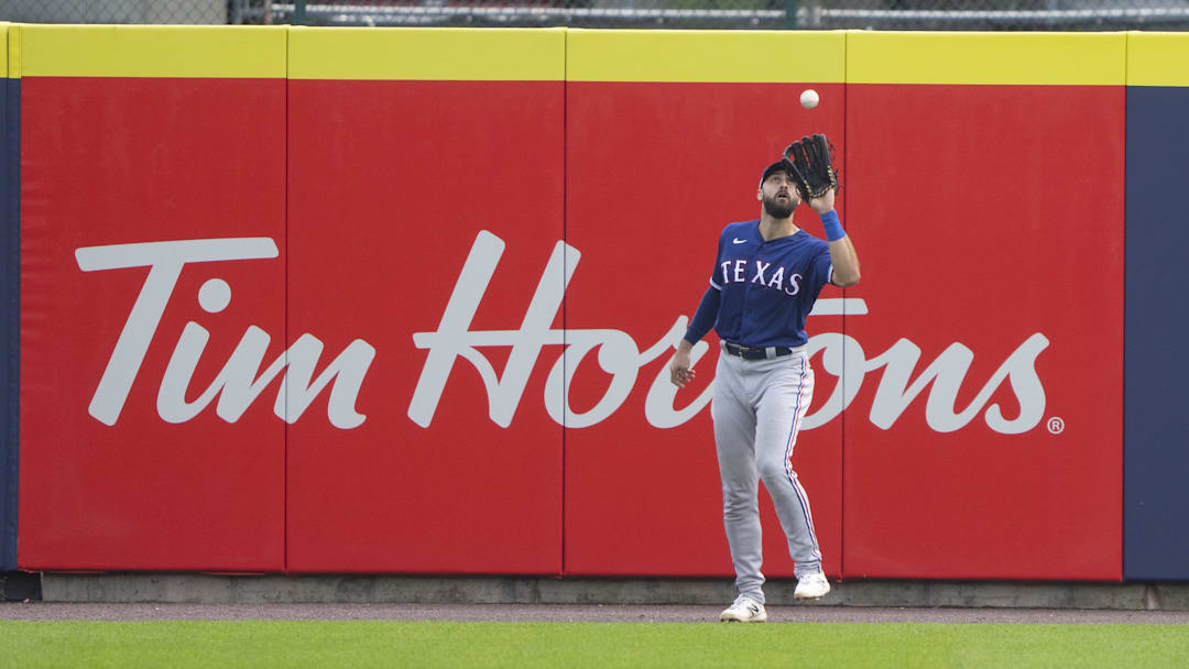 Jul 18, 2021; Buffalo, New York, CAN; Texas Rangers right fielder Joey Gallo (13) catches a fly ball hit by Toronto Blue Jays second baseman Marcus Semien (10) (not pictured) during the third inning at Sahlen Field. Gregory Fisher-Imagn Images