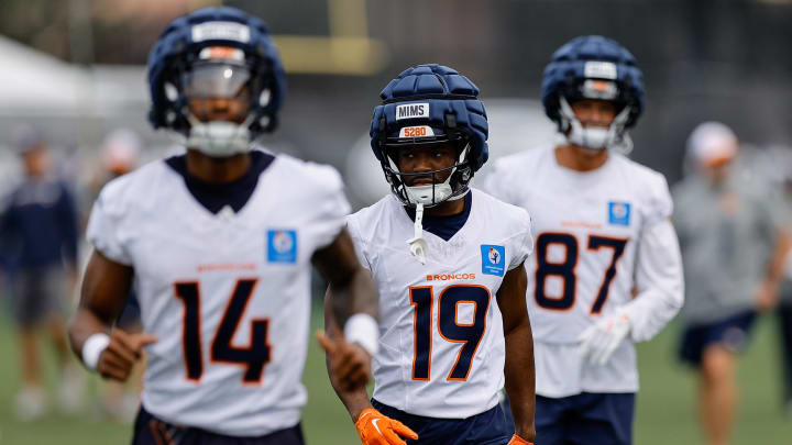 Jul 26, 2024; Englewood, CO, USA; Denver Broncos wide receivers Courtland Sutton (14), Marvin Mims Jr. (19), David Sills V (87) during training camp at Broncos Park Powered by CommonSpirit.