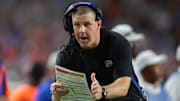 Florida Gators head coach Billy Napier call for a timeout against the Miami Hurricanes during the fourth quarter at Hard Rock Stadium.